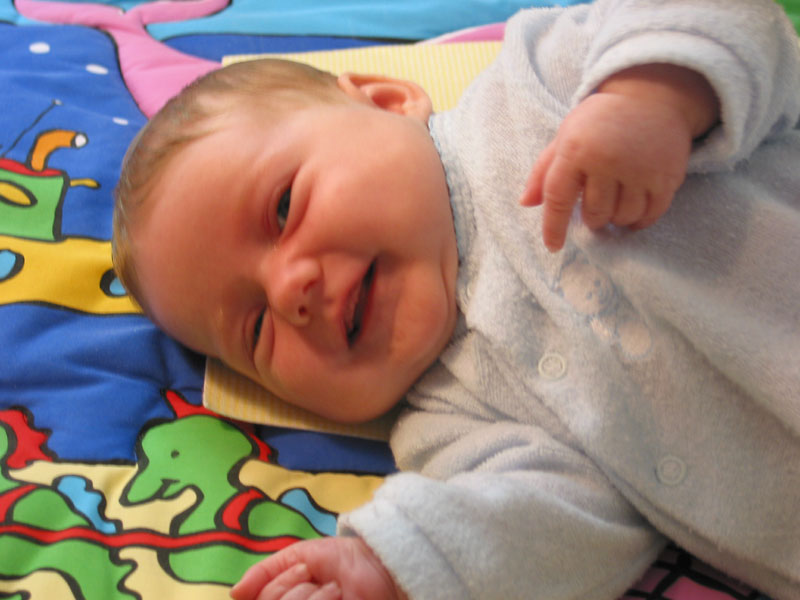 Age: 2 months Definately got the smile goin' on. She has started to have longer awake times and is typically in a good mood. Until she gets hungry, that is.