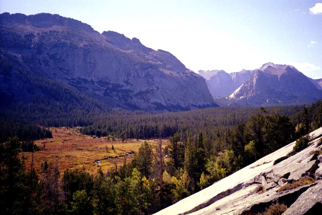 We headed down the valley to a granite slab. Since we didn't have any rock climbing gear with us, we didn't go too high. I probably went about 100' up but it was easy. The rock got steeper and more featureless up higher. It would have been an easy solo with rock shoes on, but in my hiking boots, I wasn't feeling very secure. Our camp is at the far right side of the meadow in this picture.